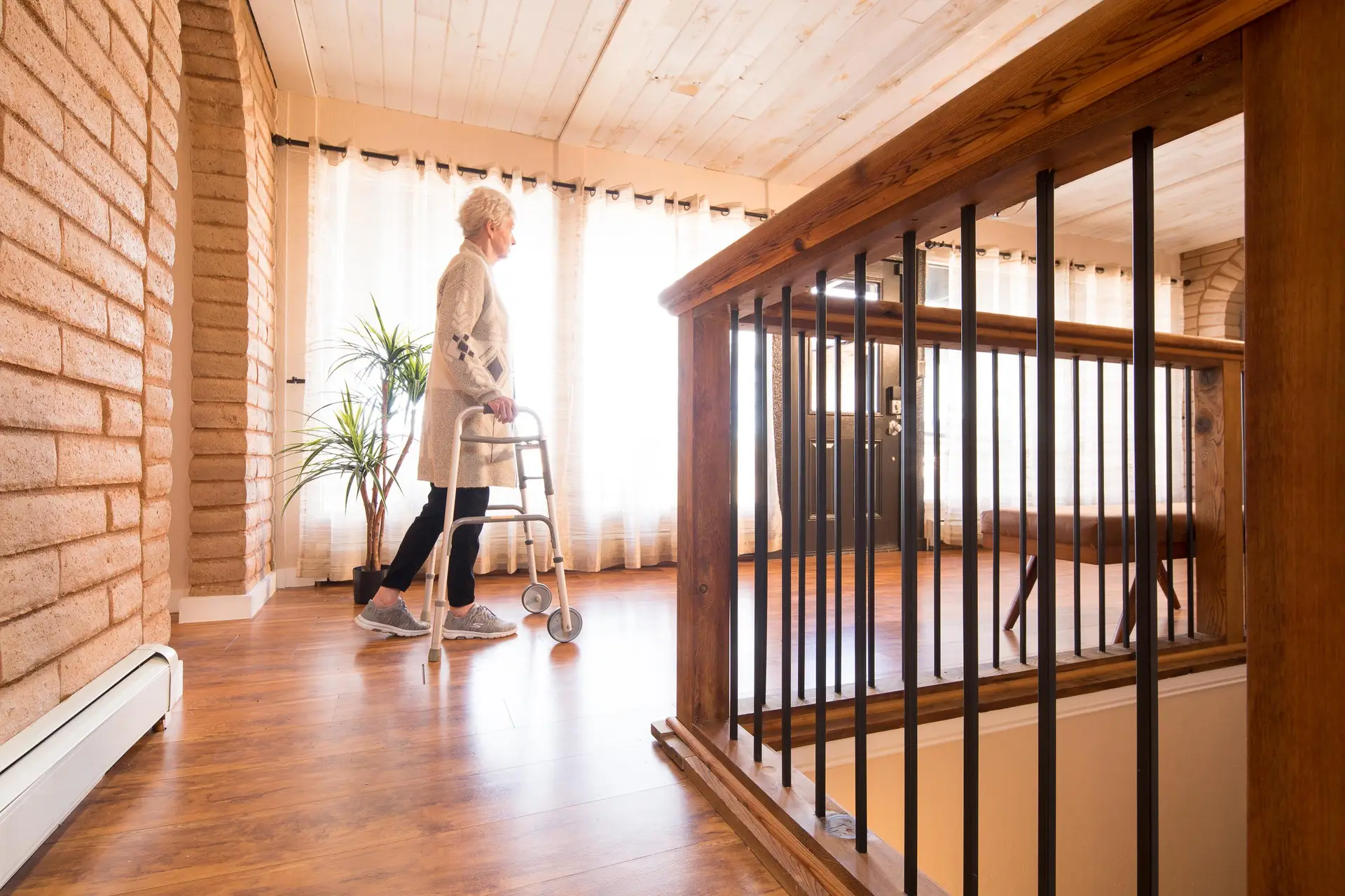 A resident at the Haven Home walks through the hall at the Haven Home in Lone tree, Colorado